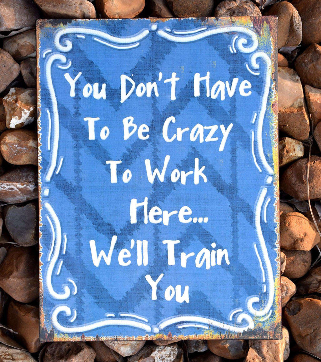 “You Don’t Have to Be Crazy to Work Here… We’ll Train You” Blue Metal Tin Sign